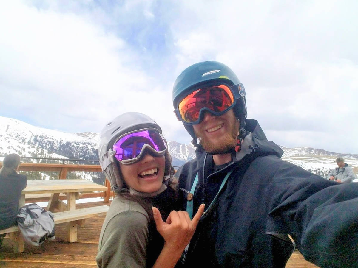 Travel Lemming Editor Abigail Bliss and her husband, posing for a photo at Loveland Ski Area