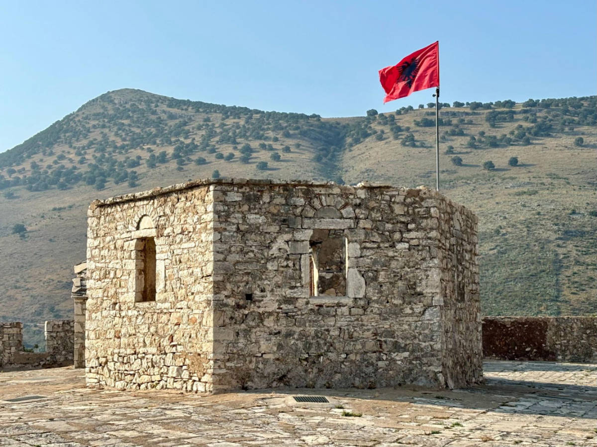 View of the Albanian flag in Porto Palermo Castle