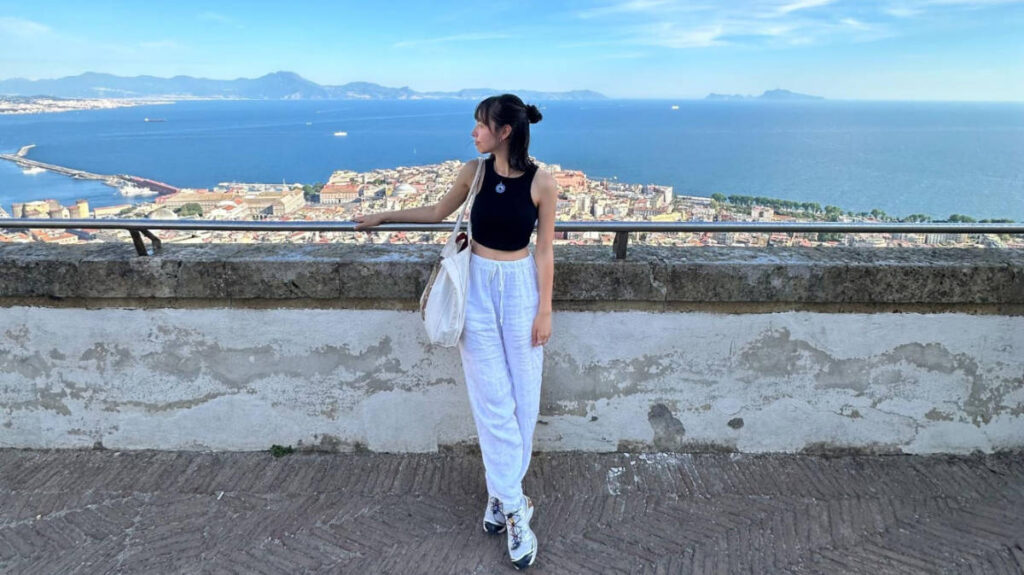 The author, Lea Rose Allbaugh smiling for a photo in Naples, Italy