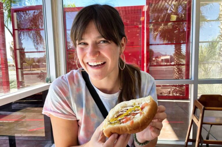 The author (Betty Hurd) holding a pastry in a local restaurant