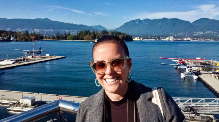 The author Catherine Driver, posing at the waterfront Vancouver