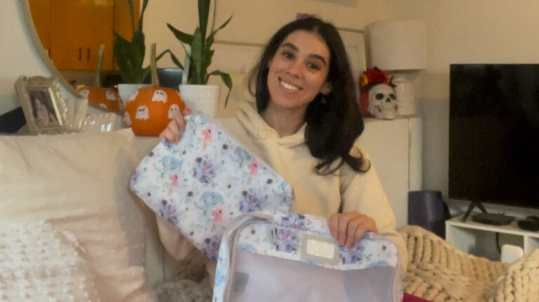 Author Claudicet showing her packing cubes for travel