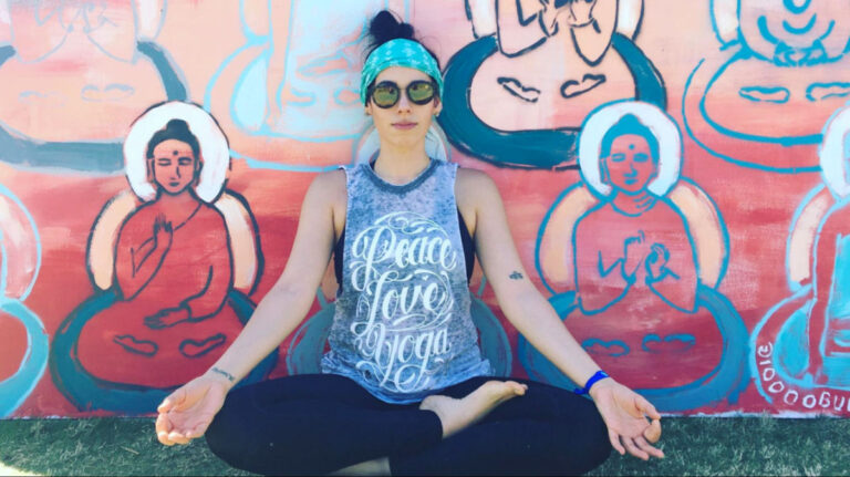 Author Claudicet doing yoga poses at the Wanderlust Fest in Atlanta