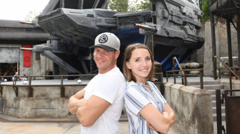 The author, Katie Neufeld with her husband posing for a photo at Disney World