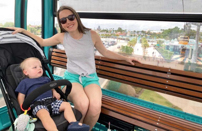 The author Katie with her son on a Skyliner in Disney World