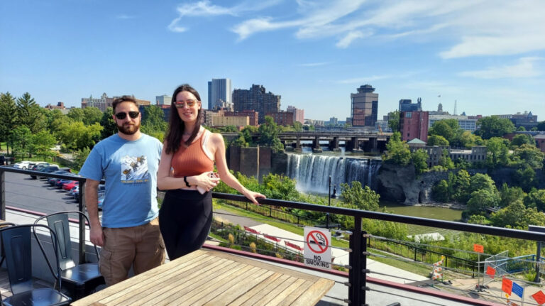 Author Niamh and her friend on Genesee Tavern rooftop across from High Falls