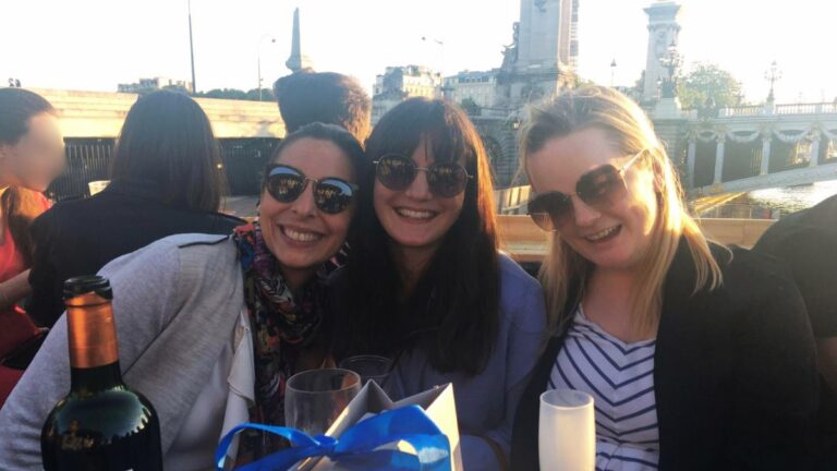 Author Rachel and her friends enjoying their wine in Paris
