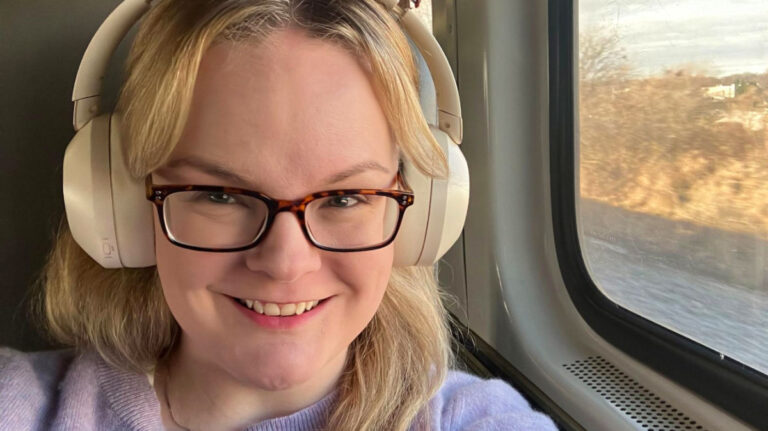 Author Rachel sitting near the window at the Borealis train