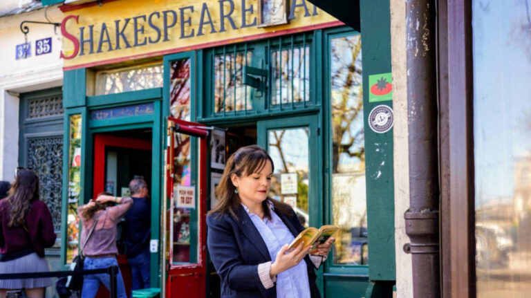 Author Rachel reading a book outside Shakespeare & Company