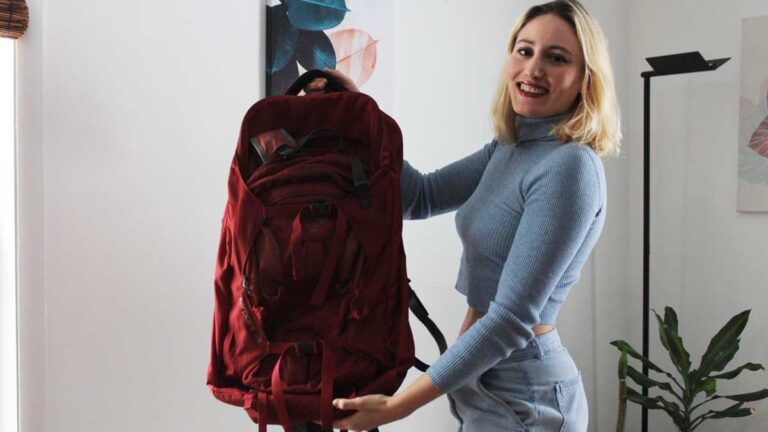 Author Sky showing her red backpack