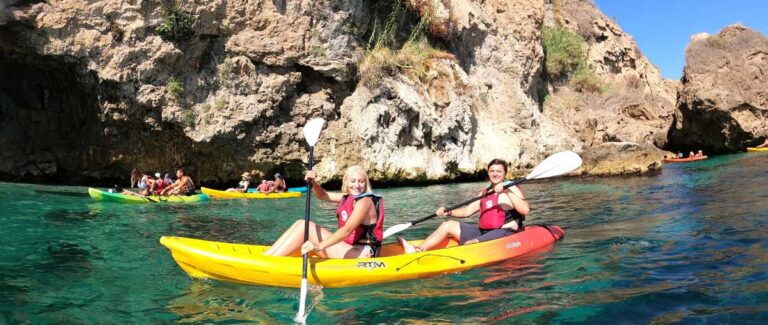 The author Sky Ariella swith her friend in a kayak in clear water
