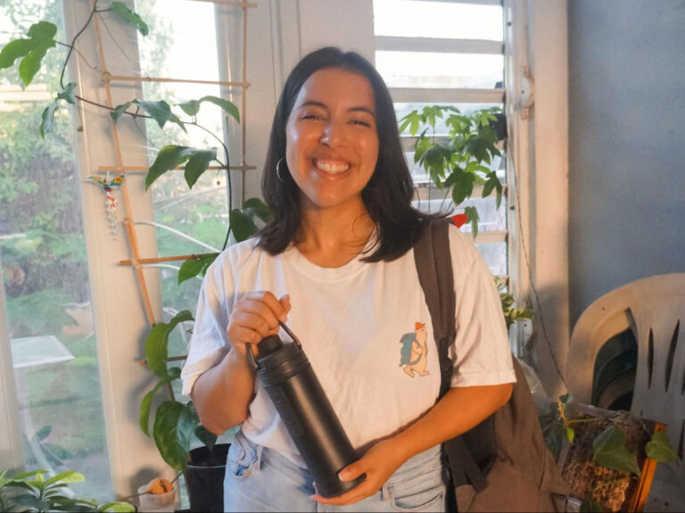 Author Vanessa holding her water flask