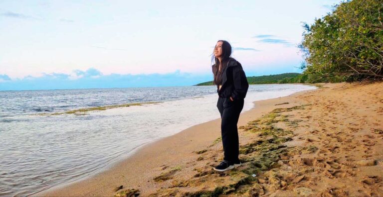 The author Vanessa admiring the view in one of the beach in Fajardo