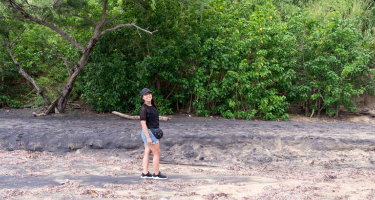 The author posing for a photo near some greeneries in Vieques