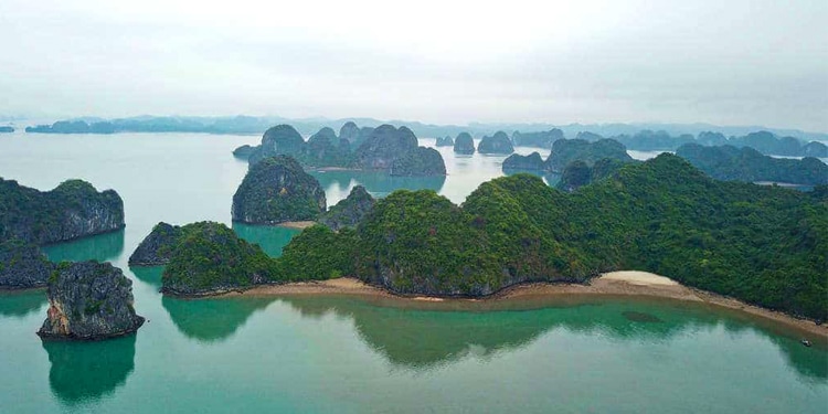 Aerial view of the pristine emerald waters, towering limestone karsts