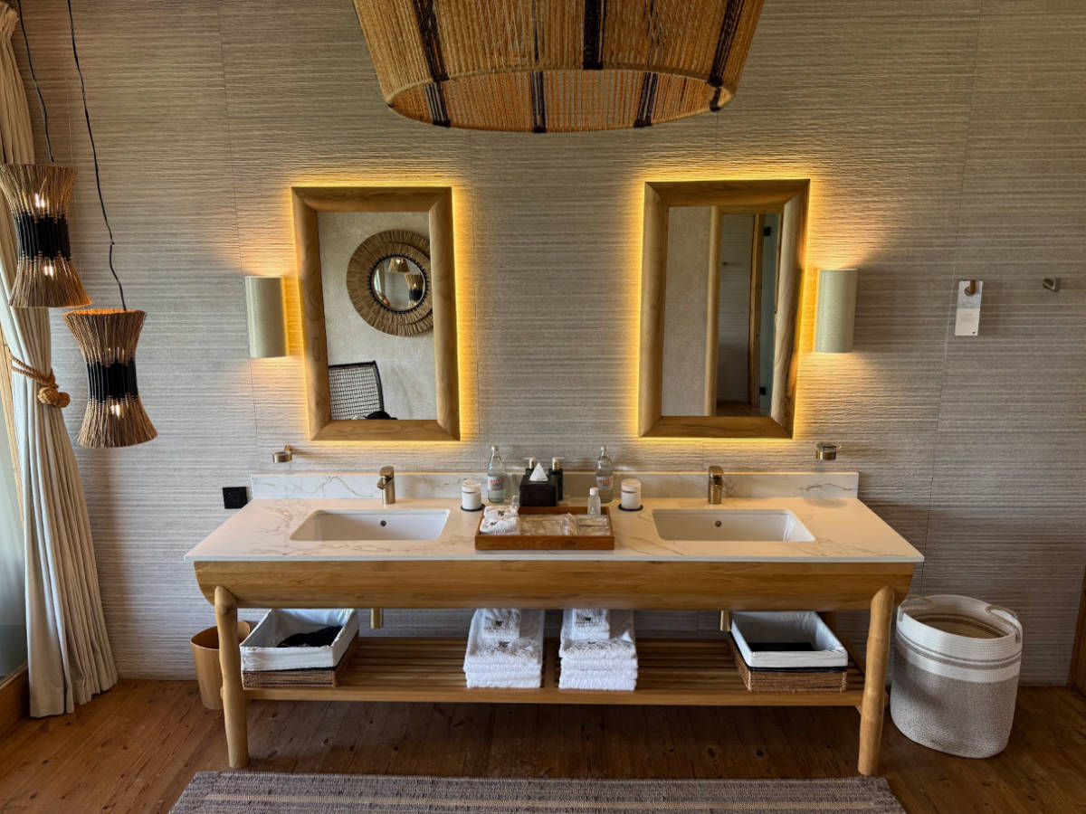 View of the warmly lit bathroom vanity