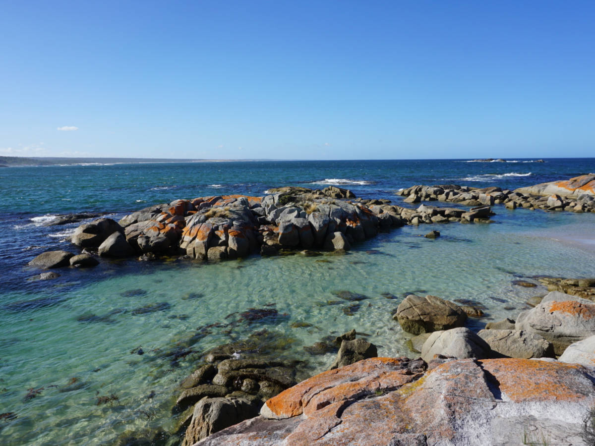 View of the famous red rocks and clear water in Bay of Fires