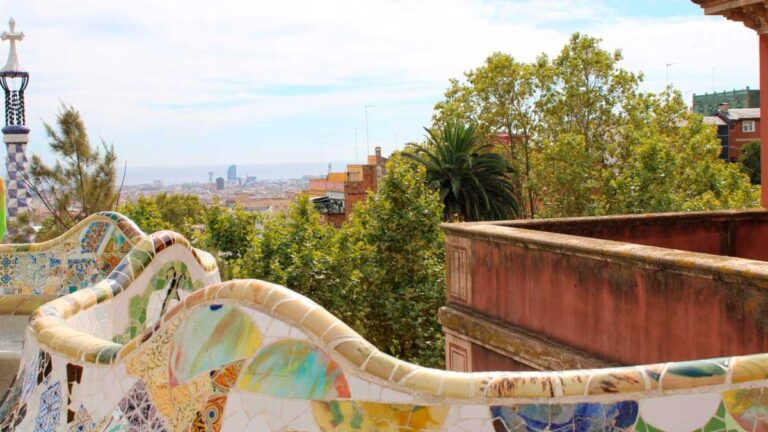 Colorful benches and the skyline view at Park Güell