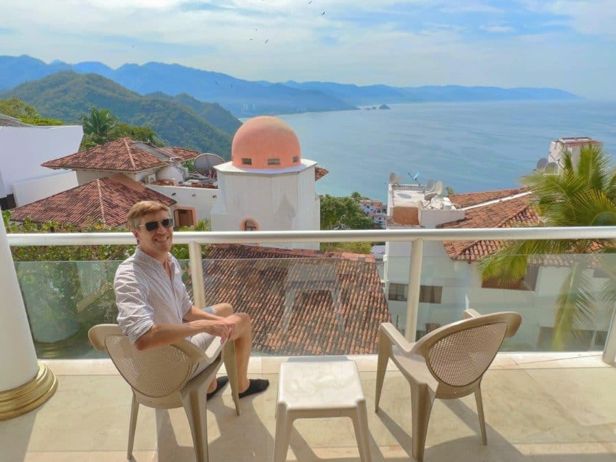 View of Nate overlooking ocean in a hotel