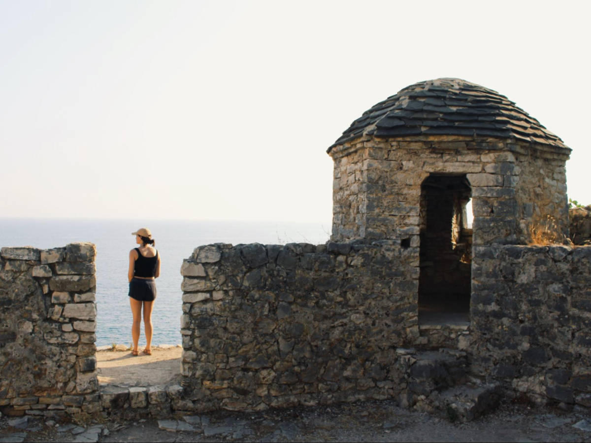 The author Betty Hurd overlooking the sea from the Porto Palermo Castle
