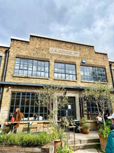 Brick exterior view of the Allpress Espresso Roastery and Cafe
