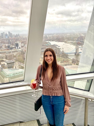Brooke Horrobin at the Sky Garden with the Tower Bridge from afar
