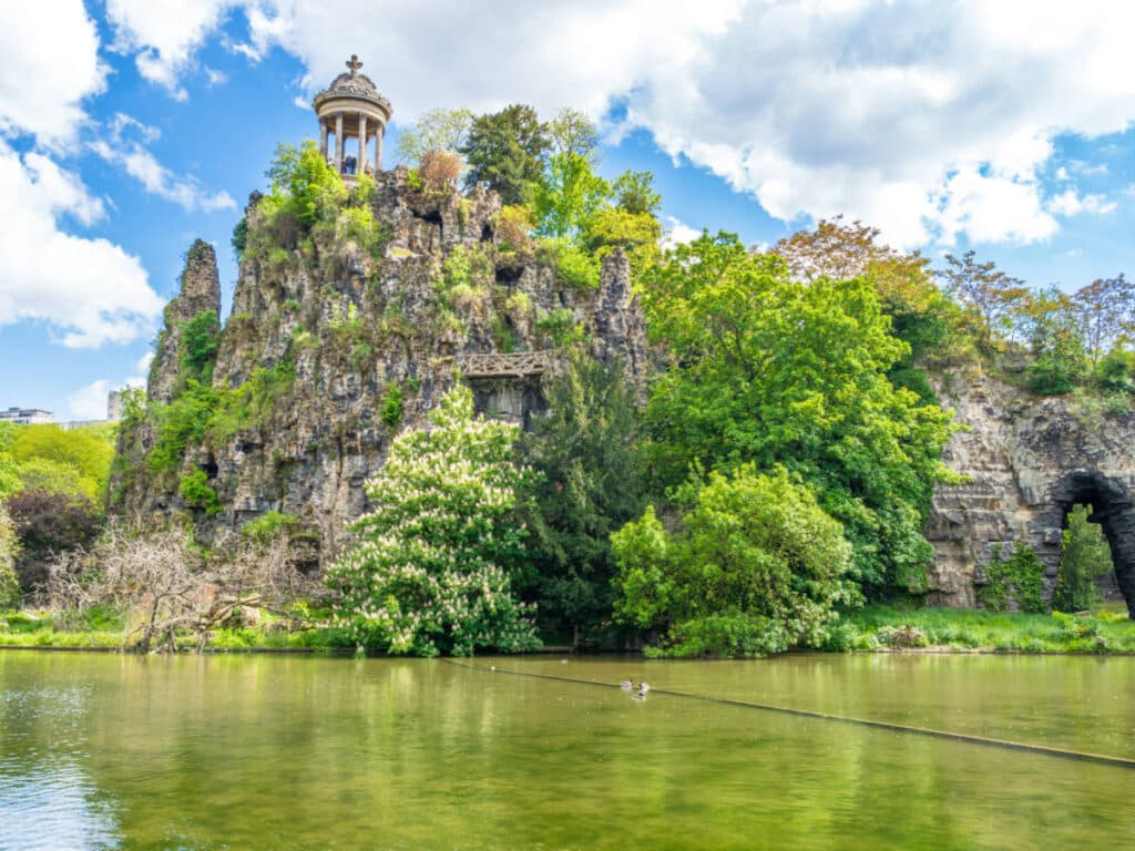 View of the lush rocky mountain in Buttes Chaumont Park