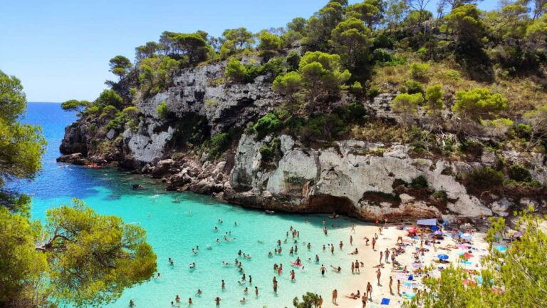 Aerial view of people enjoying their day at Cala Macarelleta
