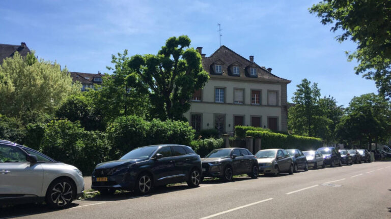 View of the cars lined along the street in Strasbourg, France