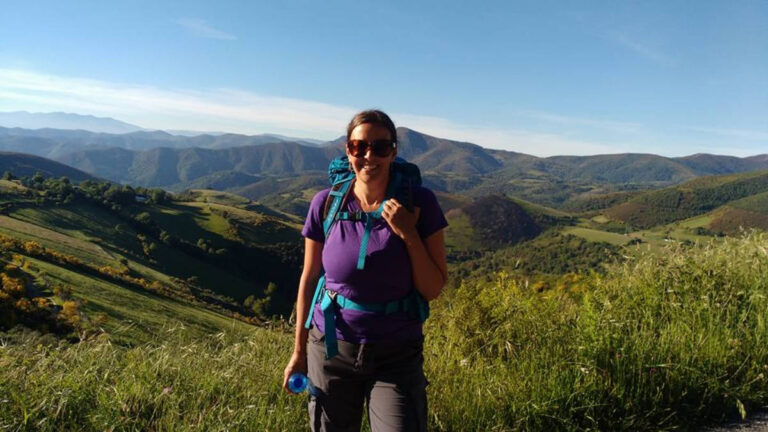 The author Catherine Driver on the Camino Francés and an overlooking view on her background
