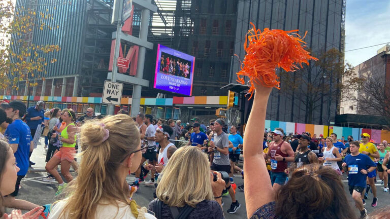 People cheering on runners in the NYC Marathon