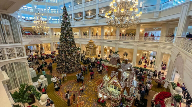 A festive view of Disney's Grand Floridian Resort adorned with Christmas decorations