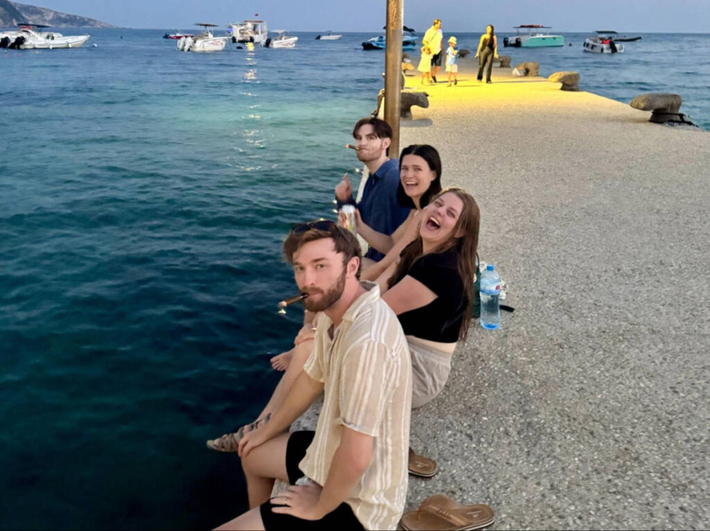 The author Betty Hurd and her friends enjoying the cigars along the dock at night