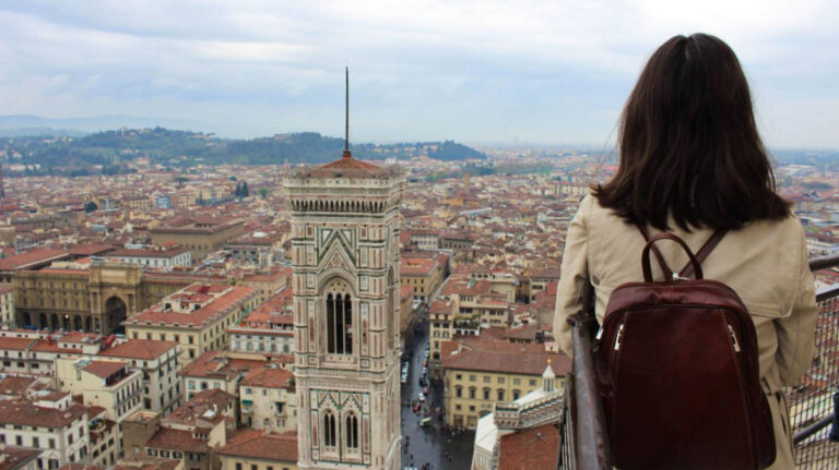 Travel Lemming Editor, Lea Rose Allbaugh, looking out over the cityscape of Florence from the top of the Duomo