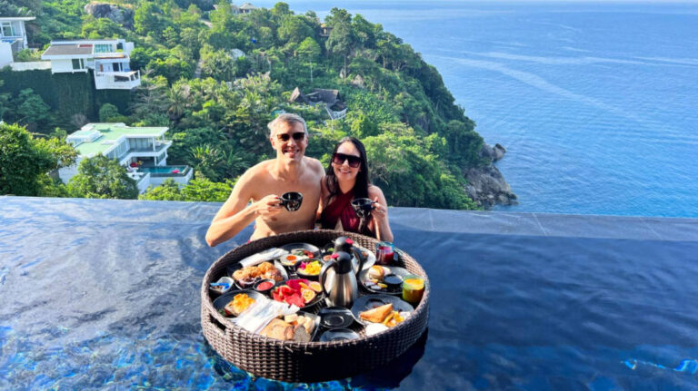 Travel Lemming founder Nate Hake and his partner Clara having their floating breakfast on the pool of Paresa Resort Phuket