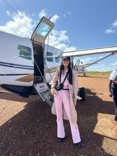 Travel Lemming writer Clara Kesseler, posing for a photo outside the Cessna at Keekorok Airstrip