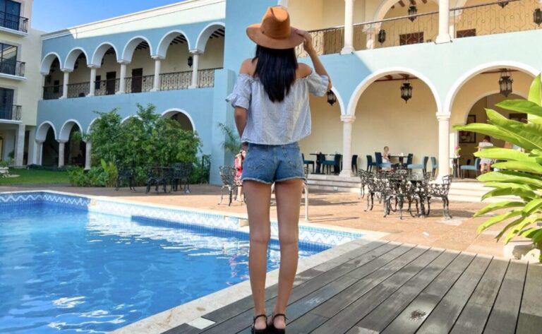 Travel Lemming Writer Clara, looking at the hotel from the pool at Real Hispano