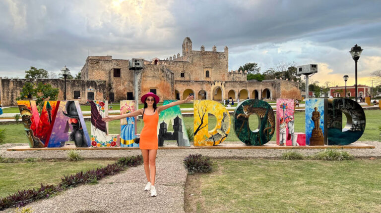 Travel Lemming writer, Clara, posing in front of the landmark signage of Valladolid
