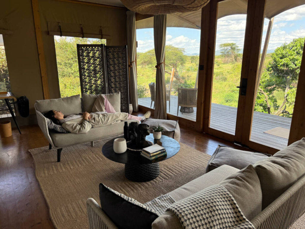 Travel Lemming writer Clara Kesseler, napping on the couch in their camp