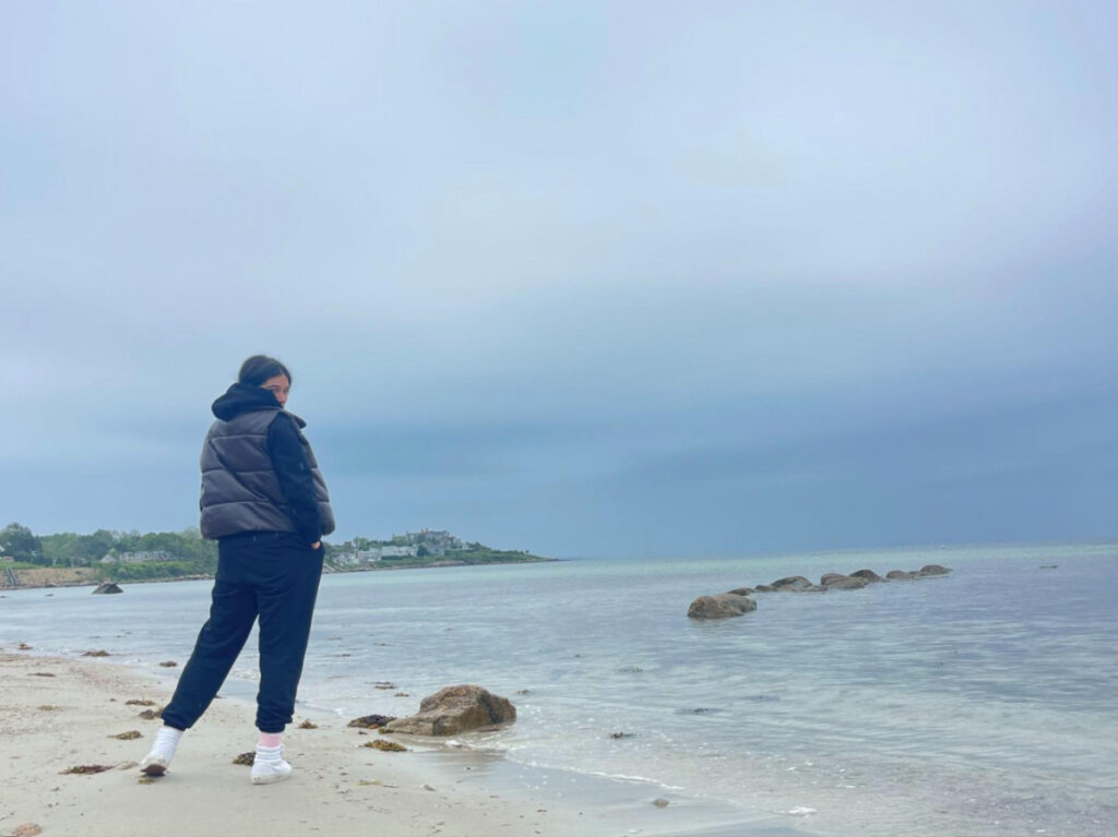 The author Claudicet Pena, posing for a photo along the Wood Neck Beach