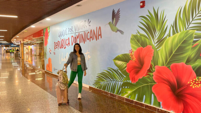 The author Claudicet posing for a photo at the Las Americas International Airport