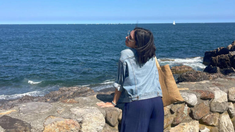 The author Claudicet Pena, enjoying the coastal views from the Castle Rock in Marblehead