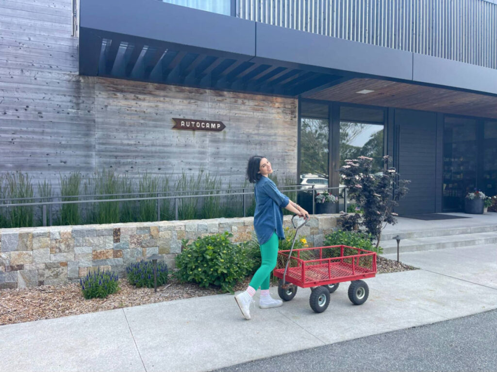 The author Claudicet Pena checking in with a red cart at AutoCamp, Cape Cod