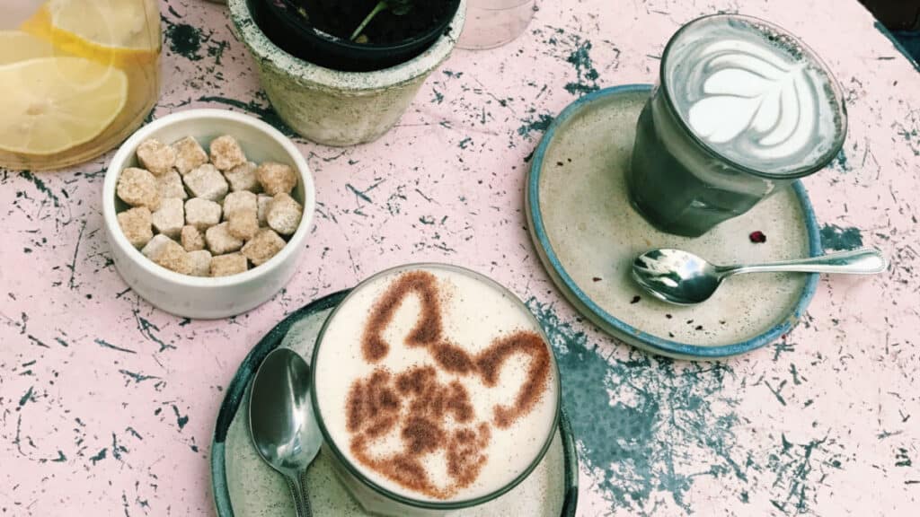 Two cups of coffee with fun latte arts in Farm Girl Cafe