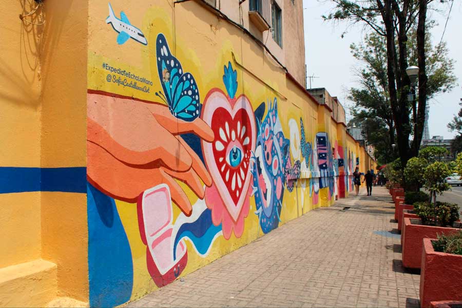 A colorful art wall in a market in Mexico City