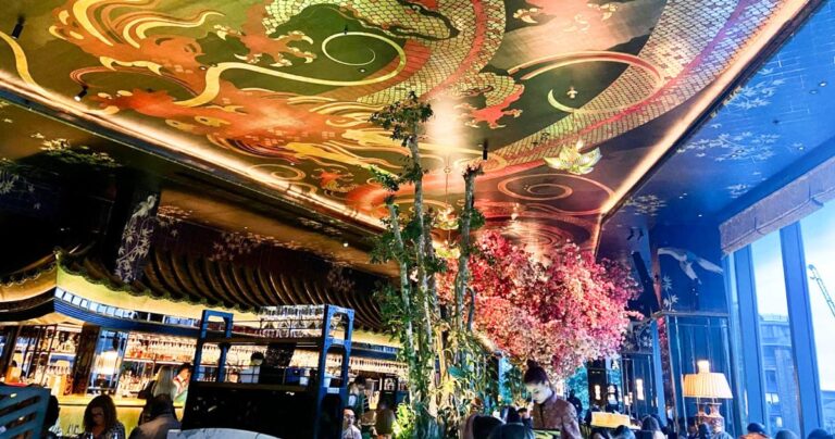 View of a colorful dragon art on the ceiling of a bar