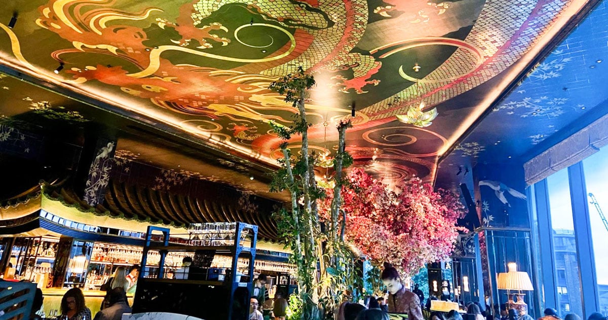 View of a colorful dragon art on the ceiling of a bar