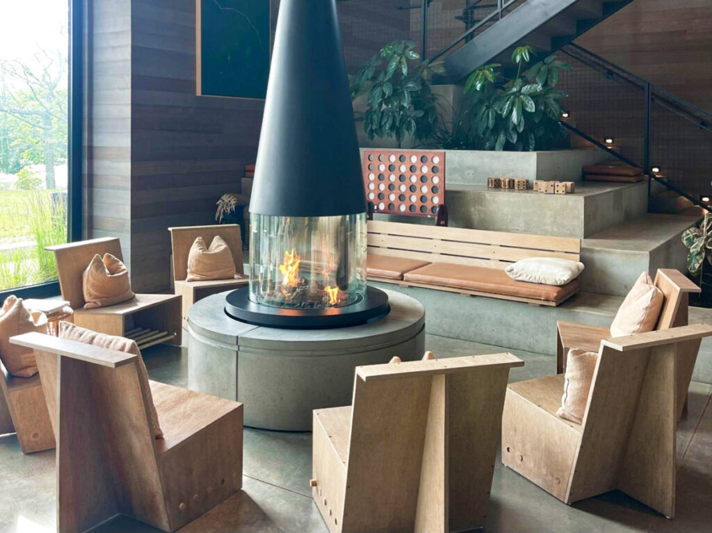 The communal fireplace surrounded by chairs