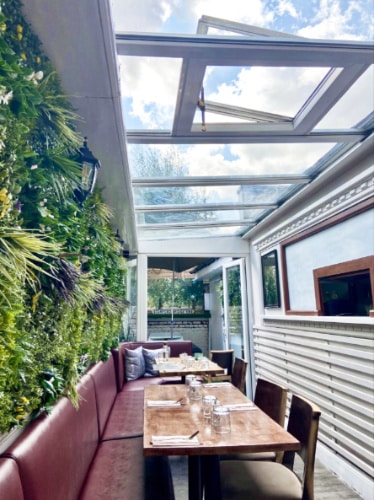 view of the outdoor seating area with glass ceiling at Matt’s Cafe in Fulham