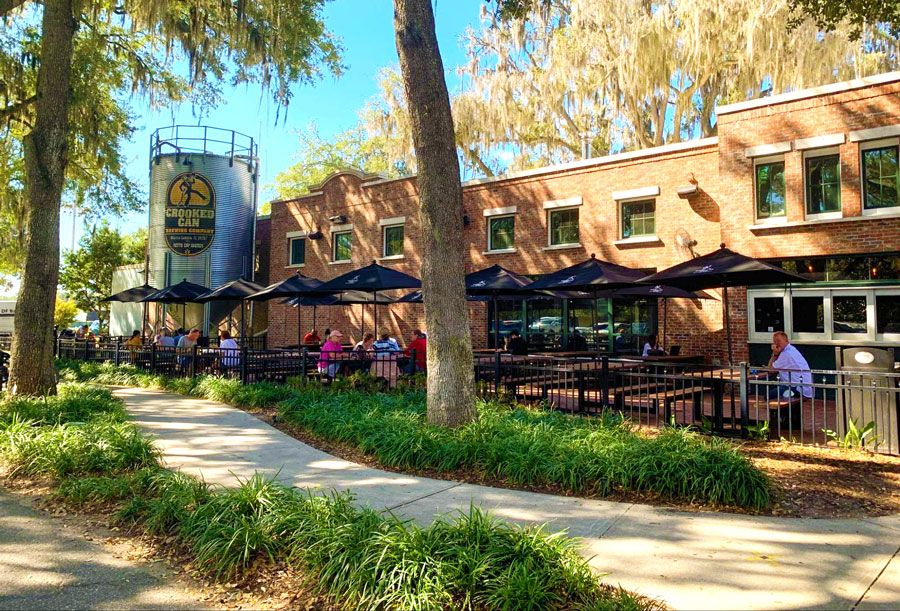 People in the outdoor seating area of Crooked Can Brewing Company